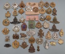 British Forces cap badges including Gloucestershire Regiment, Royal Artillery, The Queen's and Royal