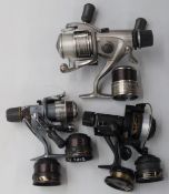 Three Shimano fixed spool fishing reels in boxes, comprising Baitrunner Aero GTE 5000B, Match