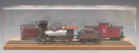 Bachmann 00 gauge American 0-4-0 Jupiter locomotive and two coaches in display case.