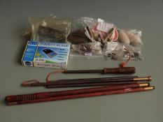 A collection of gun accessories including a campaign cleaning rod, .45 blanks, pocket scale etc