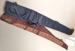 Two padded gun slips bags, one Buffalo River the other brown leather.