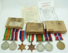 British Forces WWII boxed medals comprising 1939/1945 Star, Italy Star, Defence Medal and War