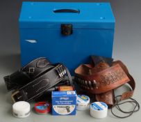 A collection of gun accessories including Sierra Saddle Co cartridge belt and holster with