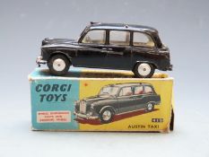 Corgi Toys diecast model Austin Taxi with black body and cream interior, 418, in original box.