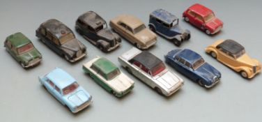 Eleven Corgi and Dinky Toys diecast model vehicles including Austin Taxi, Morris 1100, Riley etc.