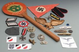 A quantity of reproduction Nazi German militaria including insignia, badges, eagle etc