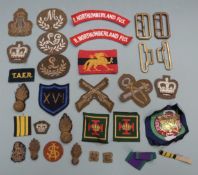 British Army cloth insignia including Northumberland Fusiliers, rank badges etc