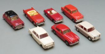 Seven Tri-ang Spot-On 1:42 scale diecast model cars comprising Sunbeam Alpine, MG Midget Mk II, MG