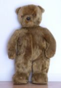 A very large vintage Teddy bear with golden mohair, 125cm tall.