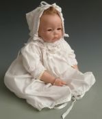 E Knoops for Werkhaus doll with open mouth, fixed brown eyes and white hooded outfit, 54cm tall.