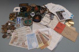 A small collection of militaria including cloth rank and regimental badges, Kosovo medal etc
