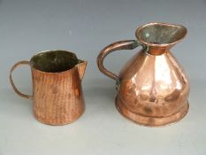 Victorian half gallon copper jug and an Arts and Crafts hammered copper example