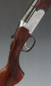 Lincoln No 2 20 bore over and under shotgun with engraved scenes of dogs and birds to the locks,