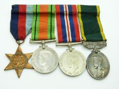 British Army WWII medals comprising 1939/1945 Star, Defence Medal, War Medal and Territorial