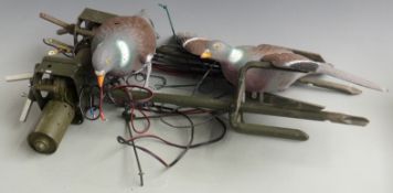 Two electric motorised flying pigeon decoy whirlers one with winged pigeon decoy together with an