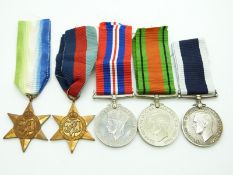 Royal Navy WWII medals comprising 1939/1945 Star, Atlantic Star, Defence Medal, War Medal and Long