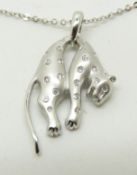 COLLECTING An 18ct white gold pendant in the form of a leopard set with diamonds, on an 18ct white