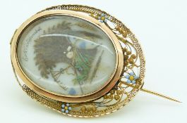 Georgian / Victorian mourning brooch, the filigree border with enamel flower decoration, set with