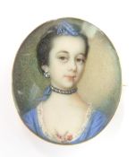 An early Victorian brooch set with a portrait miniature of a lady, 3.3 x 2.8cm