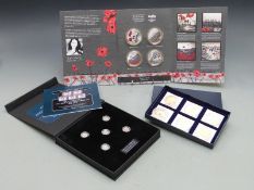 Three First World War related coin collections to include King George V threepence set for each year