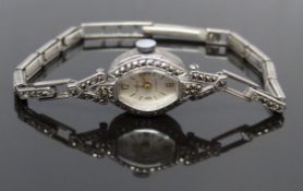 Komos silver and marcasite ladies cocktail watch with gold hands and silver dial, case diameter