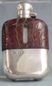 George V hallmarked silver and leather covered glass hip or spirit flask with bayonet cap and pull
