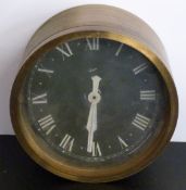 Gibson brass bulkhead military clock with black Roman dial, 20cm diameter