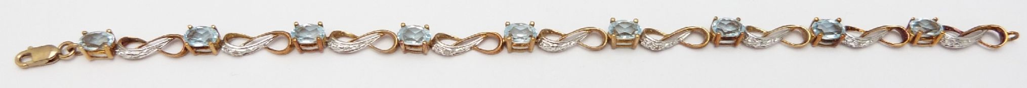 A 9ct gold bracelet set with aquamarines, 5.9g