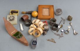 A collection of bijouterie including hallmarked silver napkin rings, military brass badge on onyx
