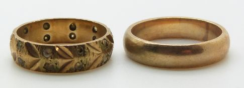 A 9ct gold wedding ring/ band and a 9ct gold eternity ring, 6.9g