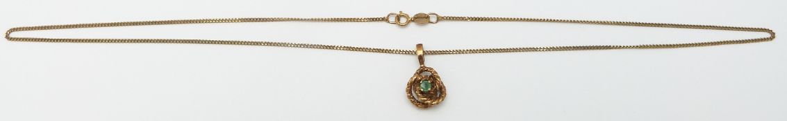 A 9ct gold necklace set with an emerald, 4.4g