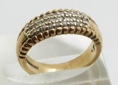 A 9ct gold ring set with three rows of diamonds, 5.0g, size L