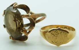 An 18ct gold signet ring, Birmingham 1914, 4.9g, and a 9ct gold ring set with paste, 9.25g.