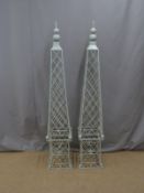 Pair of painted metal garden obelisks, height 162cm