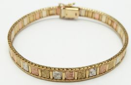 A 9ct gold tri-coloured bracelet, 13.1g