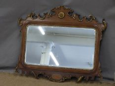 Regency or similar mirror with gilt scrolling details and bevelled glass, 95 x 80cm overall