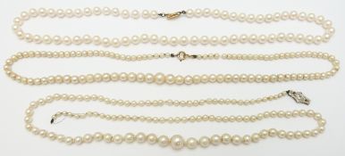 A single strand of cultured pearls with a 9ct white gold clasp, and two single strands of cultured