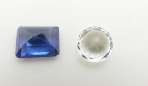 A loose round cut white sapphire and a rectangular step cut synthetic sapphire measuring 4.1ct