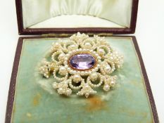 Georgian/ Victorian brooch set with seed pearls and a central foiled amethyst, in original box