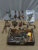 Vintage tools including spanners, tap and dies set hand cranked grindstone, drills, drill bits,