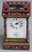 Late 19th/ early 20thC brass carriage clock with enamelled decoration to case and pillared