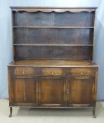 Oak dresser with plate rack above and three drawers with cupboards to base, W153 x D50  x H189cm