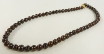 A single strand of boulder opal