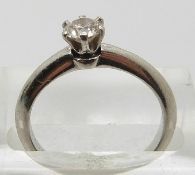 Tiffany and Co platinum ring set with a round brilliant cut diamond measuring approximately 0.