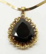An 18ct gold pendant set with large pear cut garnet on a 10k gold ribbon necklace, 4g