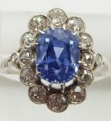 A platinum ring set with a mixed cushion cut natural untreated cornflower blue Sri Lankan sapphire