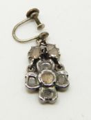 A Georgian silver earring set with seven diamonds in a foiled setting