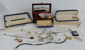 A collection of costume jewellery including cased buttons, marcasite necklace, silver bracelet,