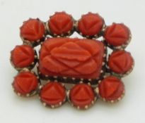 Victorian brooch set with carved coral, 2 x 1.6cm