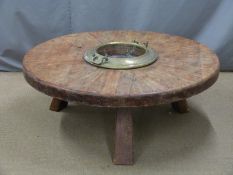 Possibly tribal circular table with central brass container, diameter 120cm height 45cm